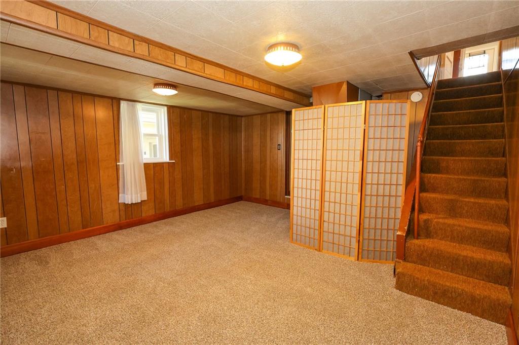 103 Whitestown Road Lyndora, PA 16045 - Photo 24 of 28 a view of an empty room with a window and a ceiling fan