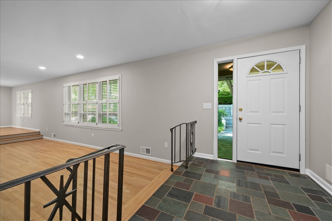 103 Satula Lane Clemson, SC 29631 - Photo 5 of 50 Enter this welcoming space featuring a vibrant tiled entryway and warm hardwood floors.