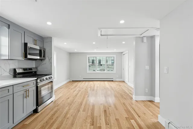 a view of kitchen with wooden floor