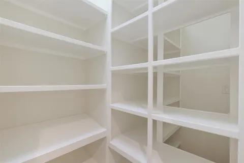 a kitchen with granite countertop sink and cabinets
