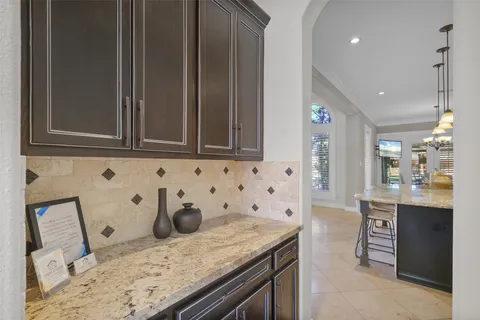 a view of a dining room with furniture wooden floor and a chandelier