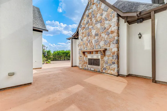 an empty room with a fireplace and painted walls