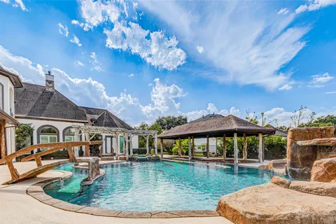 a view of an chairs and table in a room