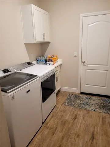 a utility room with washer and dryer