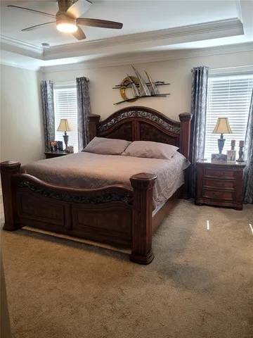 a bedroom with a bed and a mirror