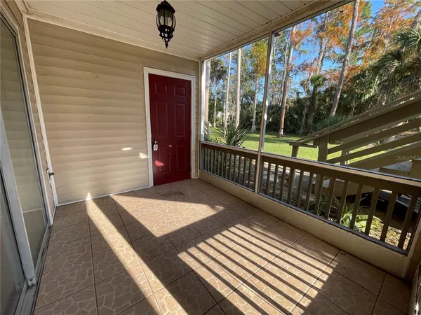 a view of a balcony with wooden floor