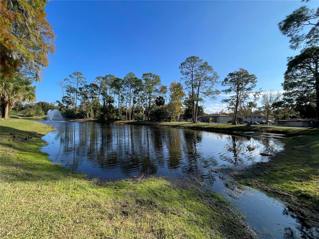 1600 Big Tree Road, Unit H3 South Daytona, FL 32119 - Photo 16 of 18 a view of a lake with houses