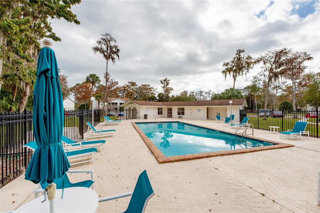 1600 Big Tree Road, Unit H3 South Daytona, FL 32119 - Photo 17 of 18 swimming pool view with a garden space