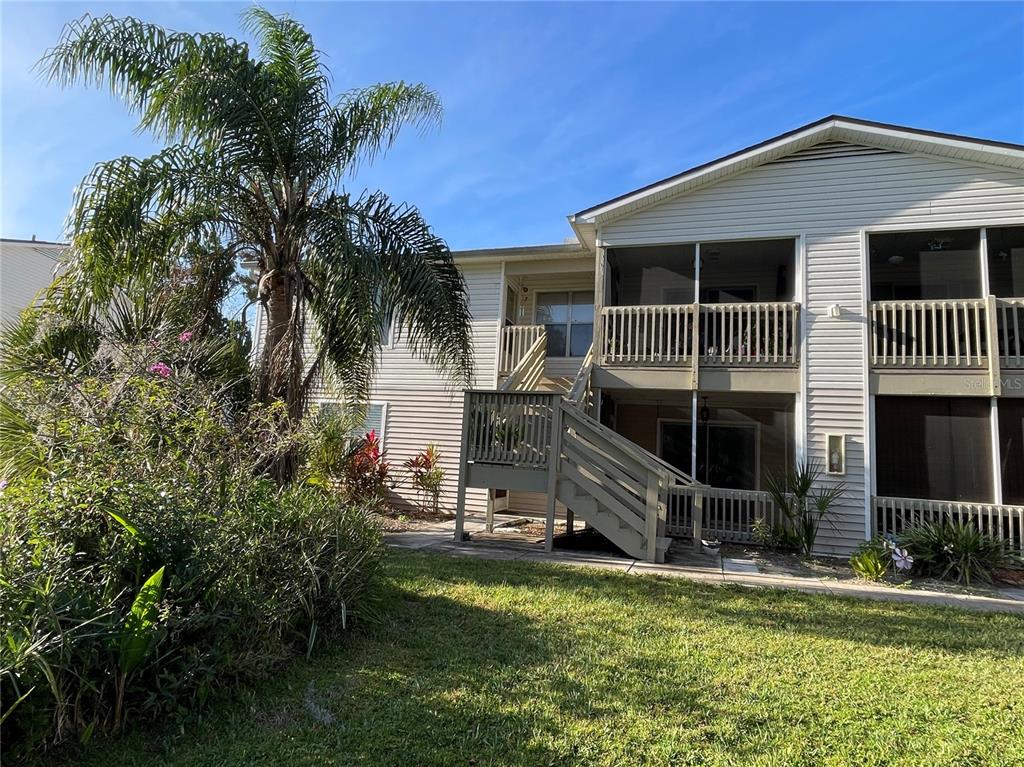 1600 Big Tree Road, Unit H3 South Daytona, FL 32119 - Photo 2 of 18 a front view of a house with a yard