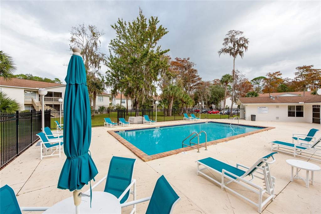 1600 Big Tree Road, Unit H3 South Daytona, FL 32119 - Photo 4 of 18 a view of a patio with a table and chairs
