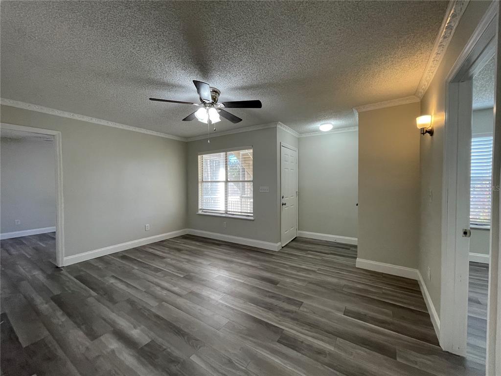 1600 Big Tree Road, Unit H3 South Daytona, FL 32119 - Photo 5 of 18 wooden floor in an empty room with a window