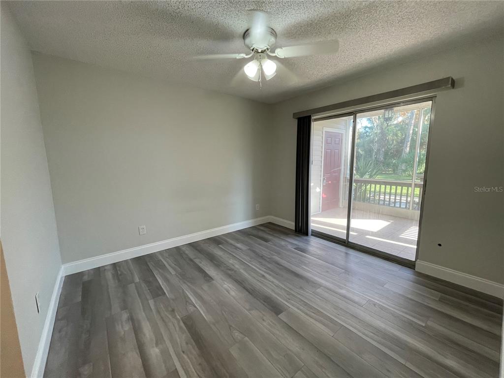 1600 Big Tree Road, Unit H3 South Daytona, FL 32119 - Photo 9 of 18 wooden floor in an empty room with a window
