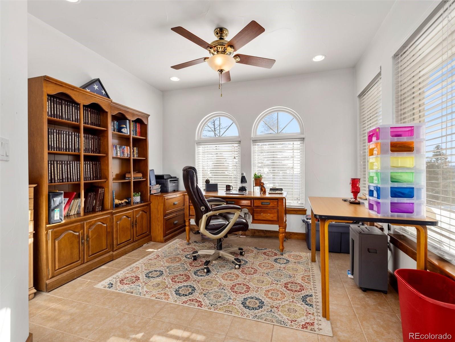 8760 Ridge Road Beulah, CO 81023 - Photo 18 of 33 a view of a workspace with furniture and a window