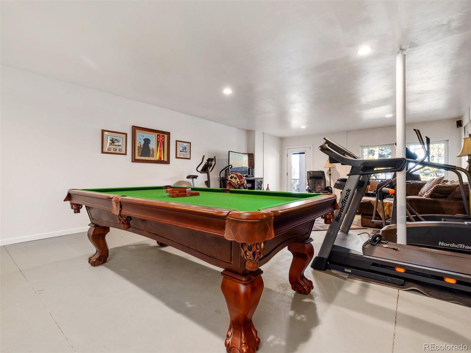 8760 Ridge Road Beulah, CO 81023 - Photo 28 of 33 a room with pool table and windows