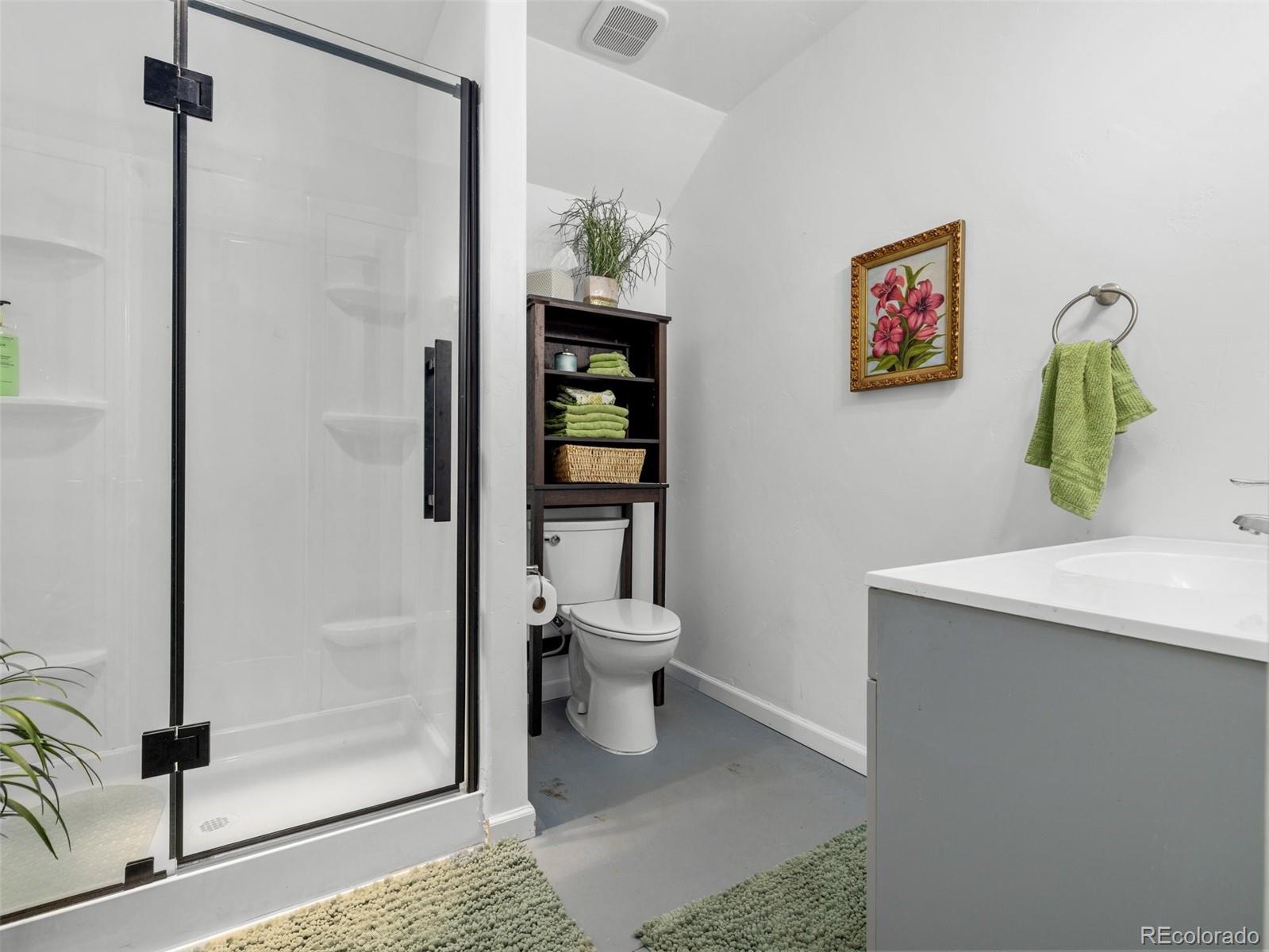 8760 Ridge Road Beulah, CO 81023 - Photo 30 of 33 a bathroom with a toilet a sink and shower
