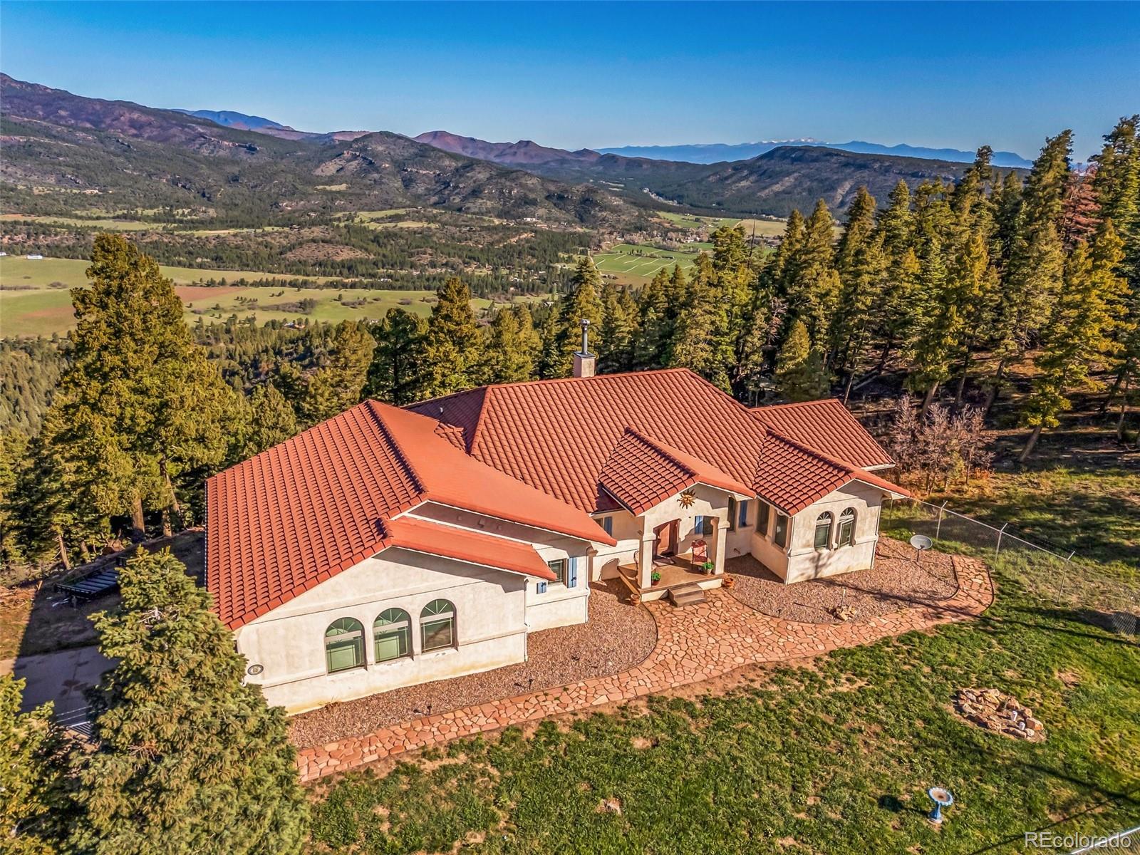 8760 Ridge Road Beulah, CO 81023 - Photo 7 of 33 a view of a house with a ocean view