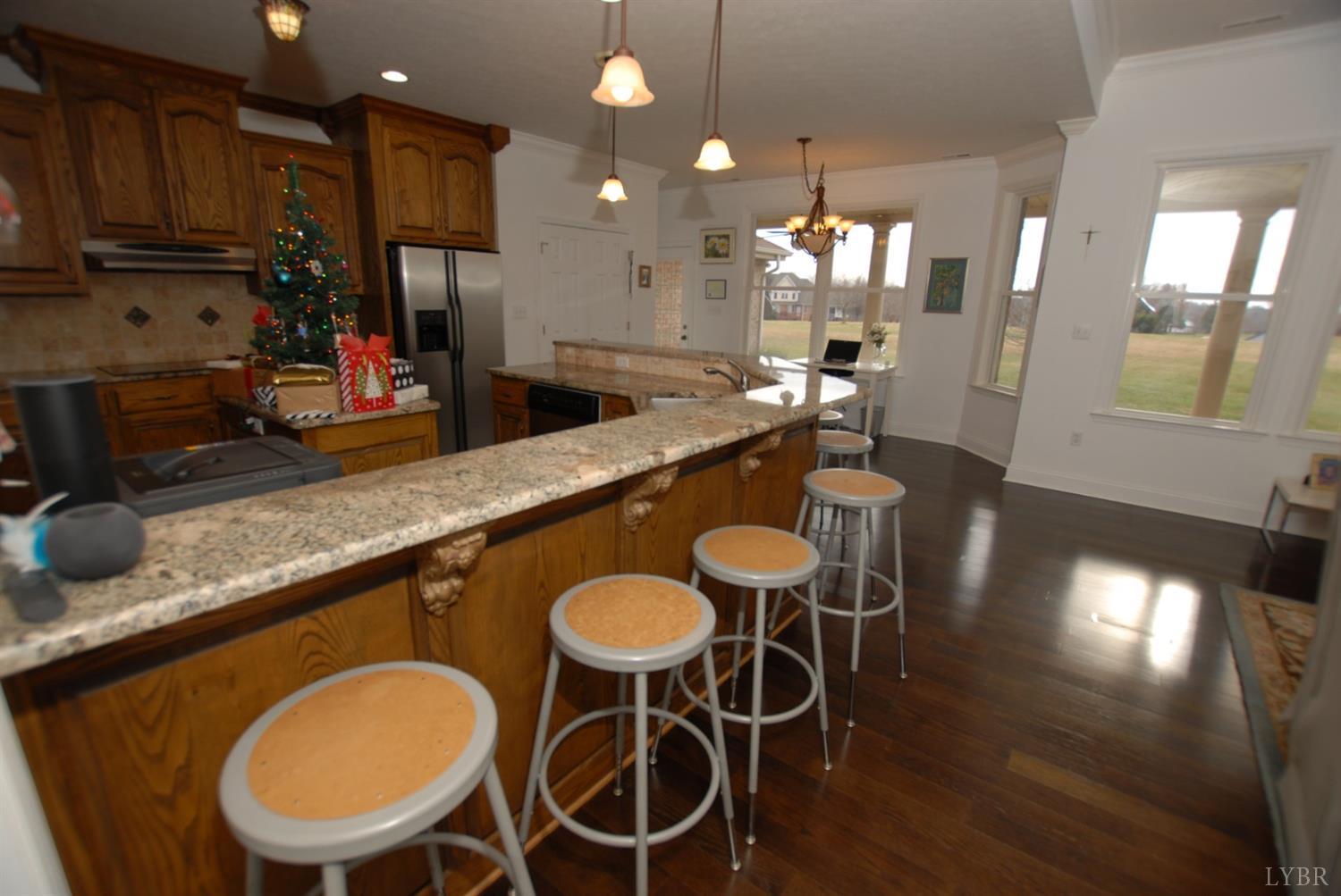 1669 Matthew Talbot Road Forest, VA 24551 - Photo 4 of 56 a large kitchen with a table and chairs