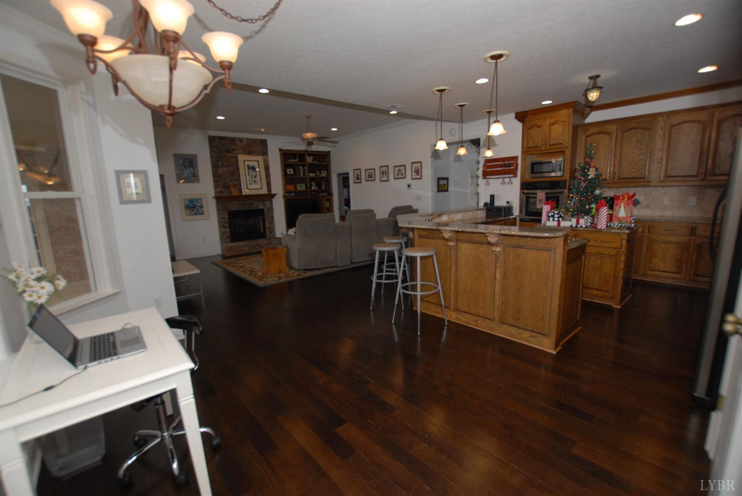 1669 Matthew Talbot Road Forest, VA 24551 - Photo 5 of 56 a view of a dining room with furniture wooden floor and a kitchen