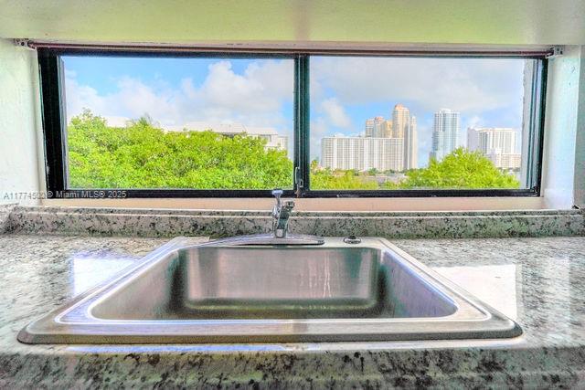 17021 North Bay Road, Unit 414 Sunny Isles Beach, FL 33160 - Photo 11 of 28 a view of a sink a window and a floor to ceiling window