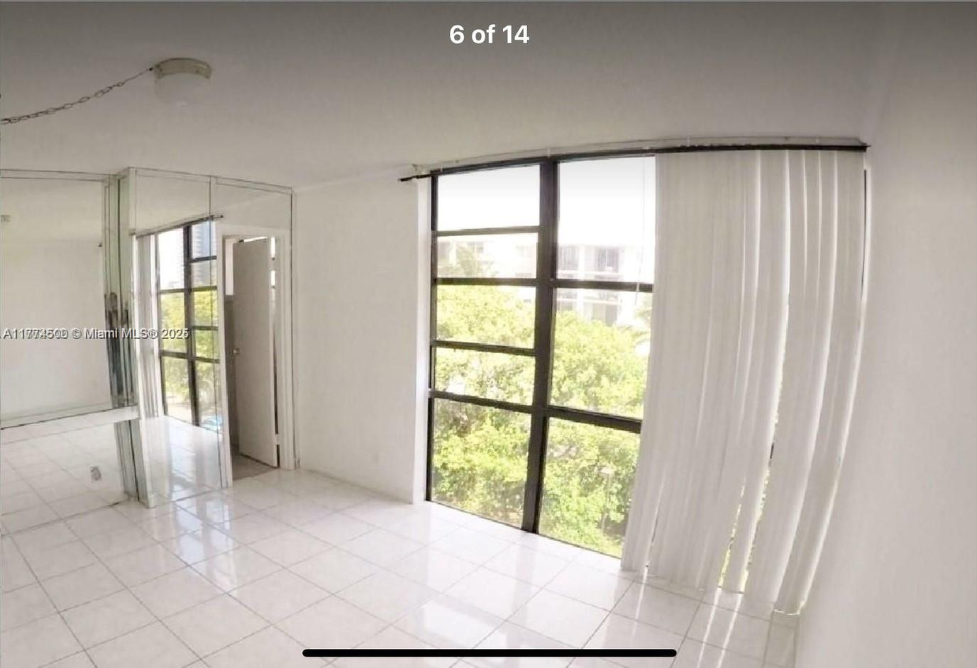 17021 North Bay Road, Unit 414 Sunny Isles Beach, FL 33160 - Photo 13 of 28 a view of an empty room with a window
