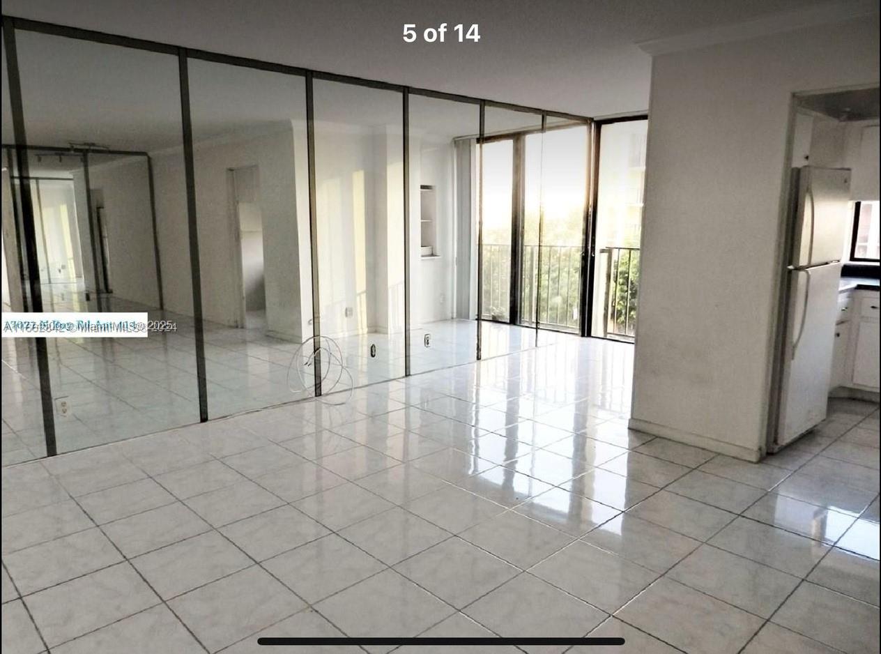 17021 North Bay Road, Unit 414 Sunny Isles Beach, FL 33160 - Photo 14 of 28 a view of a bathroom with a glass door shower