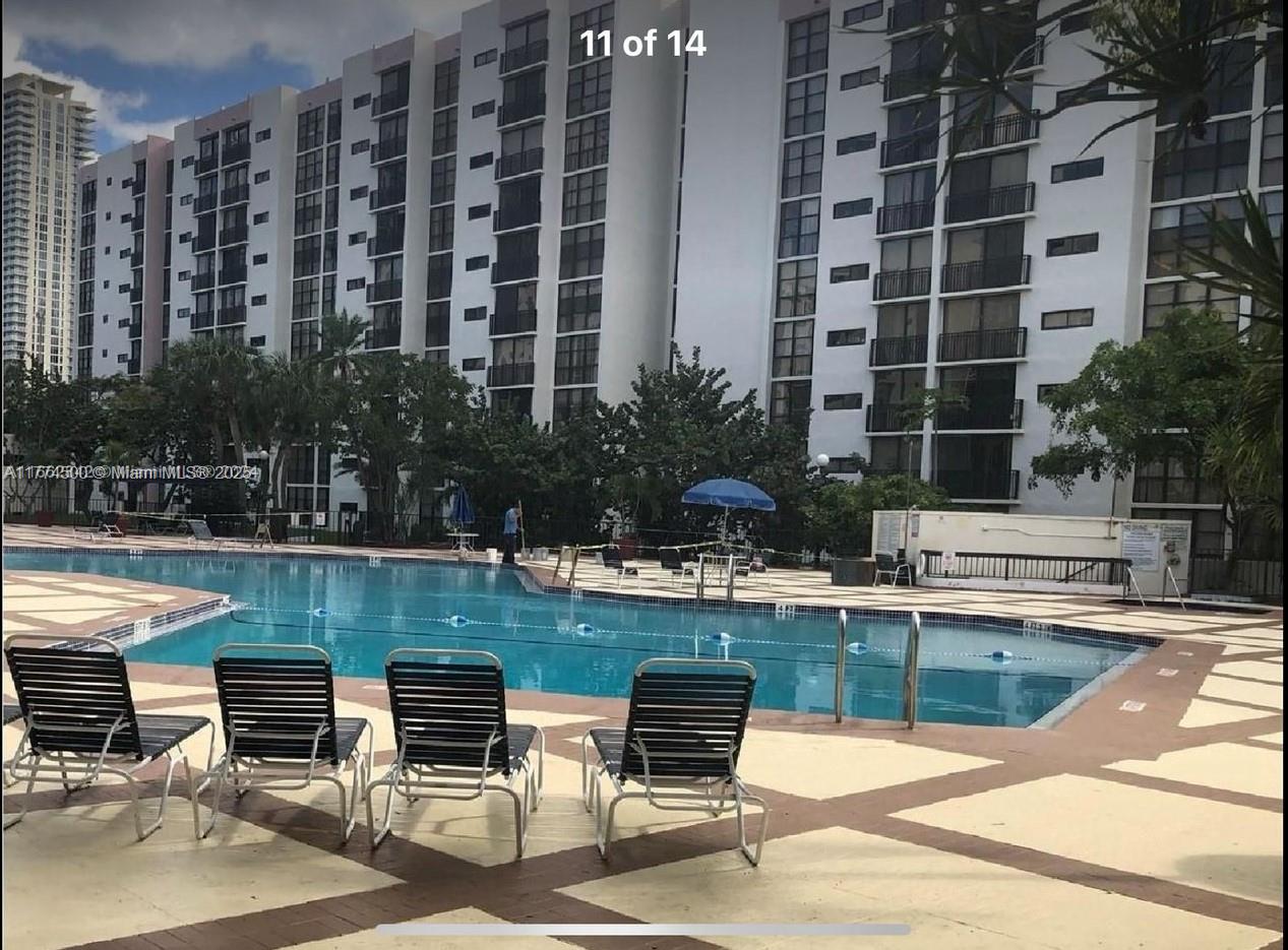 17021 North Bay Road, Unit 414 Sunny Isles Beach, FL 33160 - Photo 16 of 28 a view of swimming pool with outdoor seating and plants