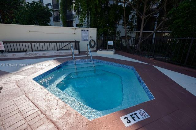 17021 North Bay Road, Unit 414 Sunny Isles Beach, FL 33160 - Photo 24 of 28 a view of a swimming pool with a patio