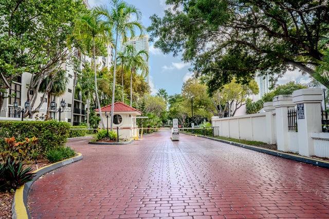 17021 North Bay Road, Unit 414 Sunny Isles Beach, FL 33160 - Photo 28 of 28 a view of a patio with a table and chairs under an umbrella