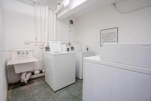 17021 North Bay Road, Unit 414 Sunny Isles Beach, FL 33160 - Photo 9 of 28 a utility room with dryer and washer