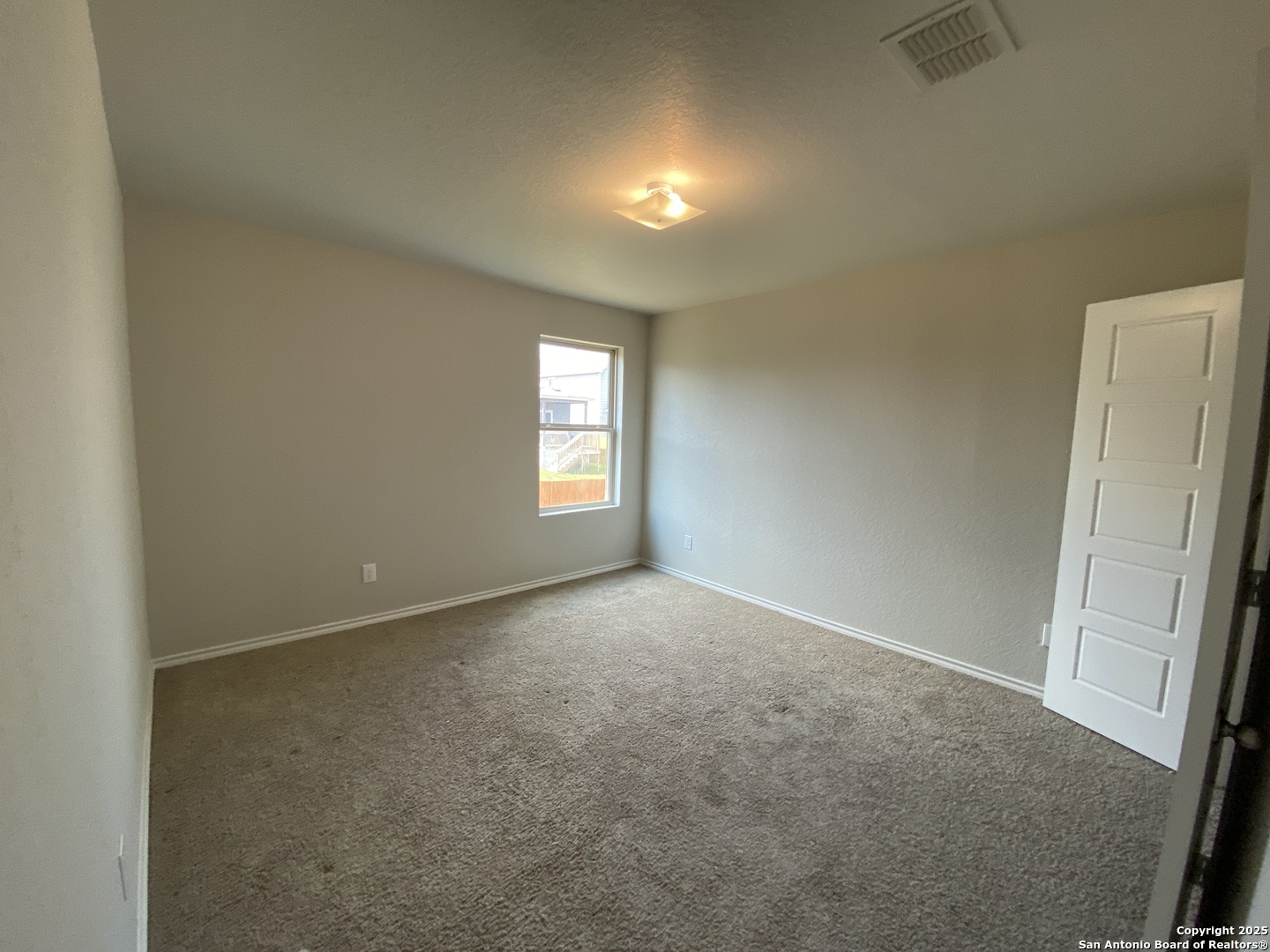 10822 Randolph Way Converse, TX 78109 - Photo 23 of 33 an empty room with windows