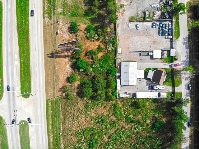 a view of a house with backyard porch and sitting area