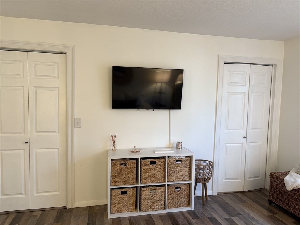 8 Shadowbrook Lane, Unit 14 Milford, MA 01757 - Photo 12 of 19 a living room with furniture and a flat screen tv