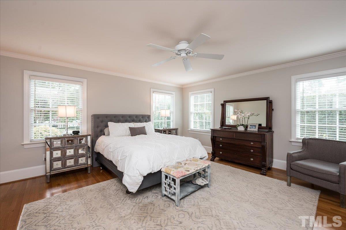 2901 Hostetler Street Raleigh, NC 27609 - Photo 14 of 25 a bedroom with a bed and a couch