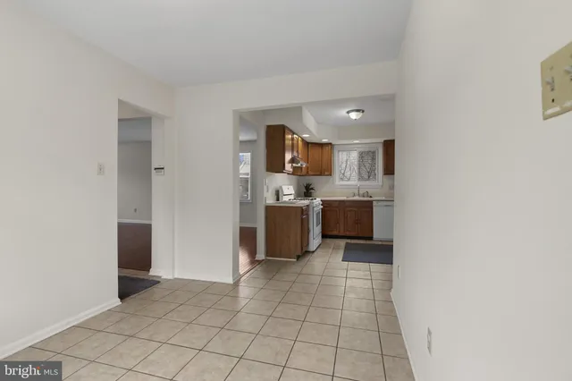 a view of a storage and utility room with washer and dryer