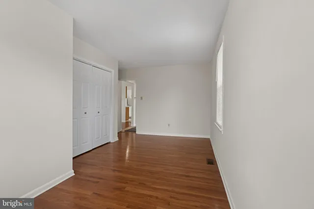 a bathroom with a sink a toilet and a window