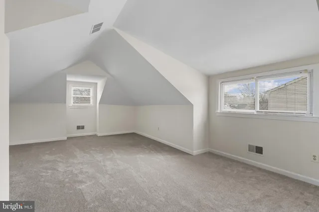 a view of an empty room with a closet