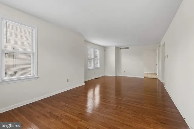 a kitchen with stainless steel appliances granite countertop a stove top oven a sink a counter space and cabinets