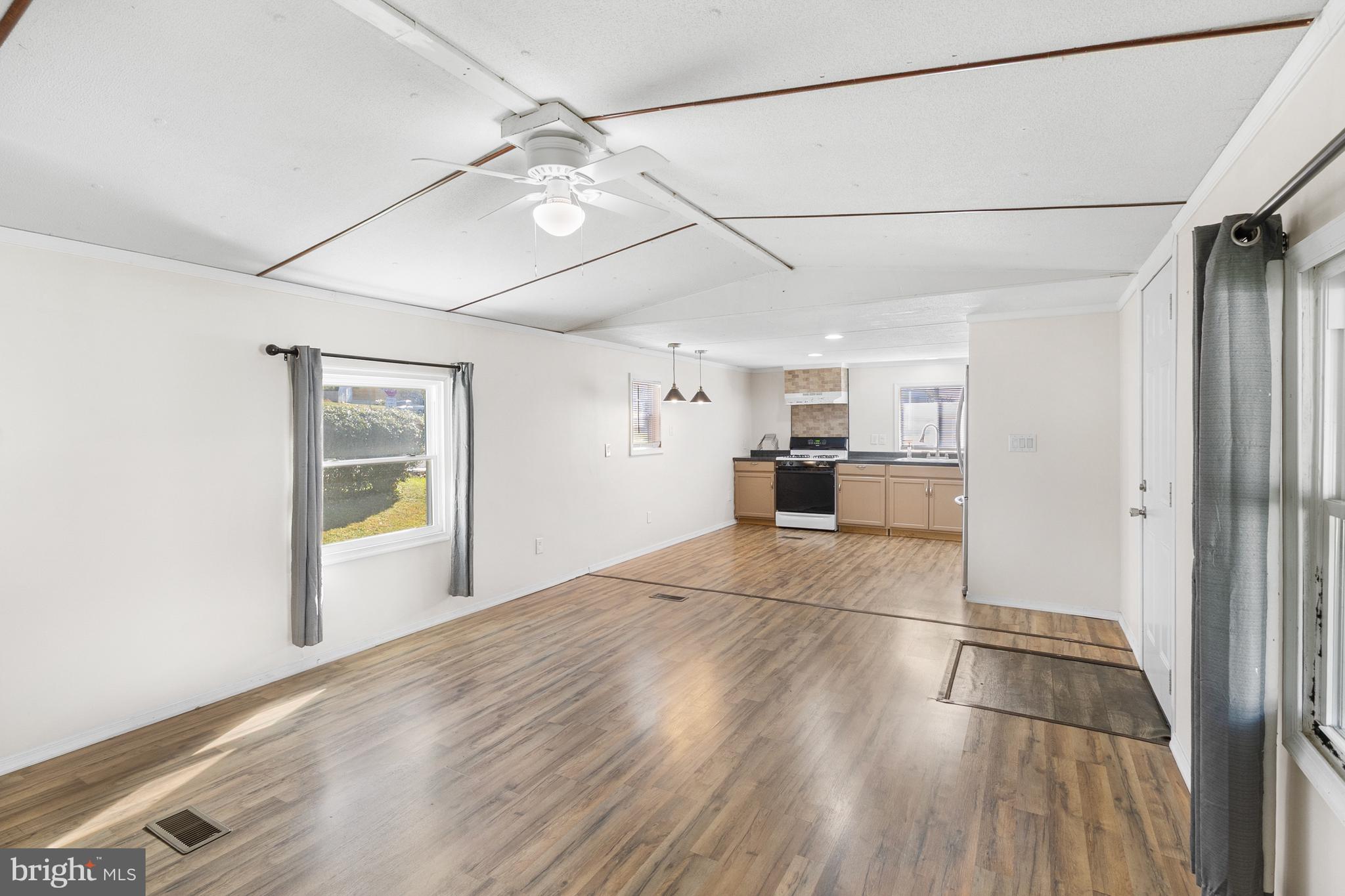 2 Westview Way West Grove, PA 19390 - Photo 1 of 26 a view of empty room with wooden floor and window