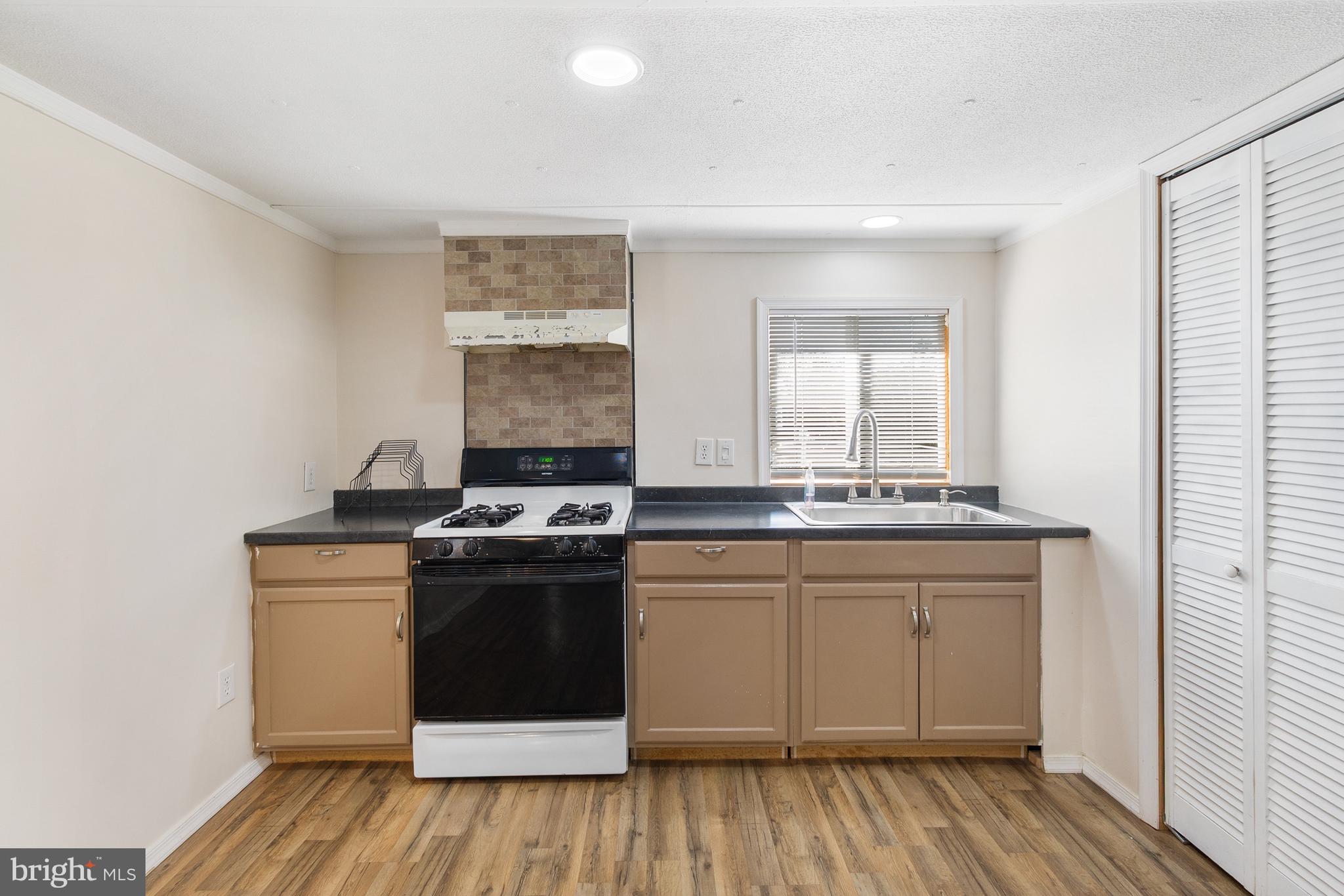 2 Westview Way West Grove, PA 19390 - Photo 12 of 26 a kitchen with a stove and white cabinets