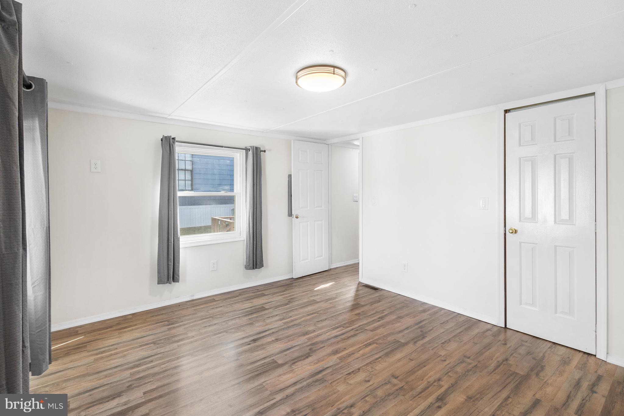 2 Westview Way West Grove, PA 19390 - Photo 14 of 26 a view of an empty room with wooden floor and closet