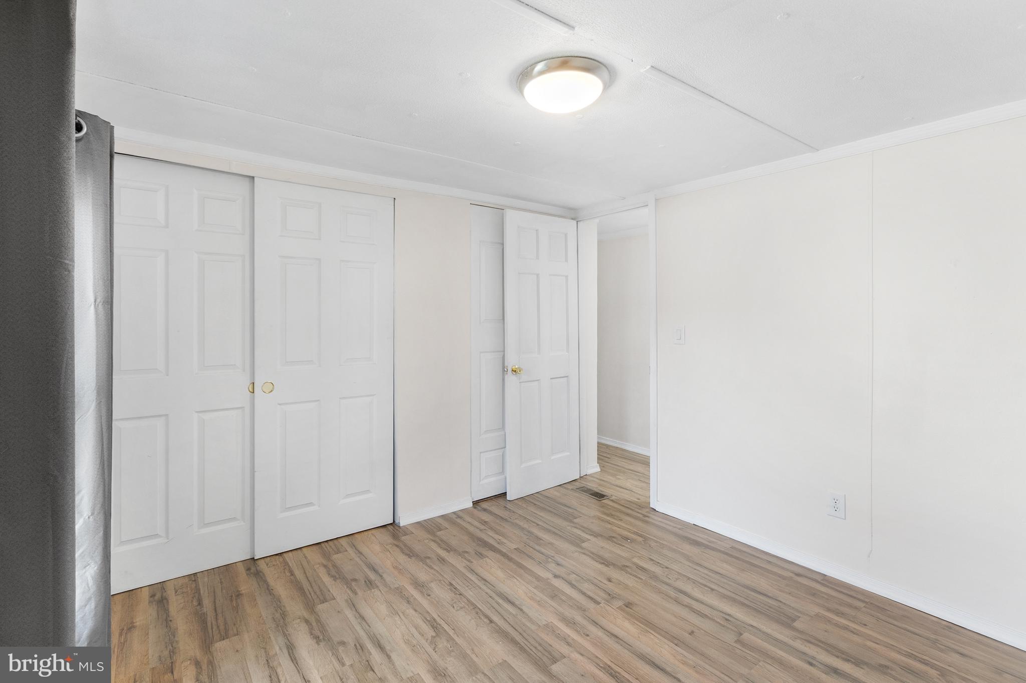 2 Westview Way West Grove, PA 19390 - Photo 17 of 26 a view of an empty room and wooden floor