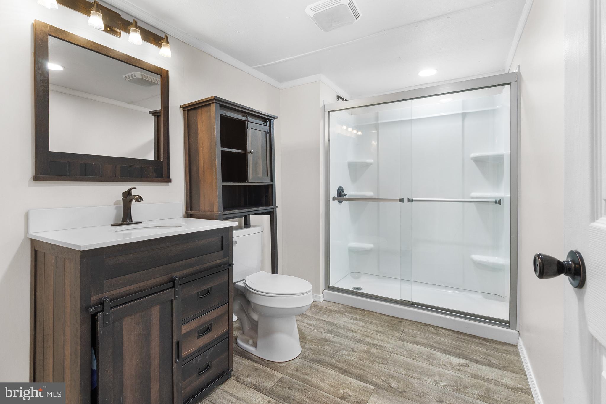 2 Westview Way West Grove, PA 19390 - Photo 20 of 26 a bathroom with a sink toilet a mirror and shower