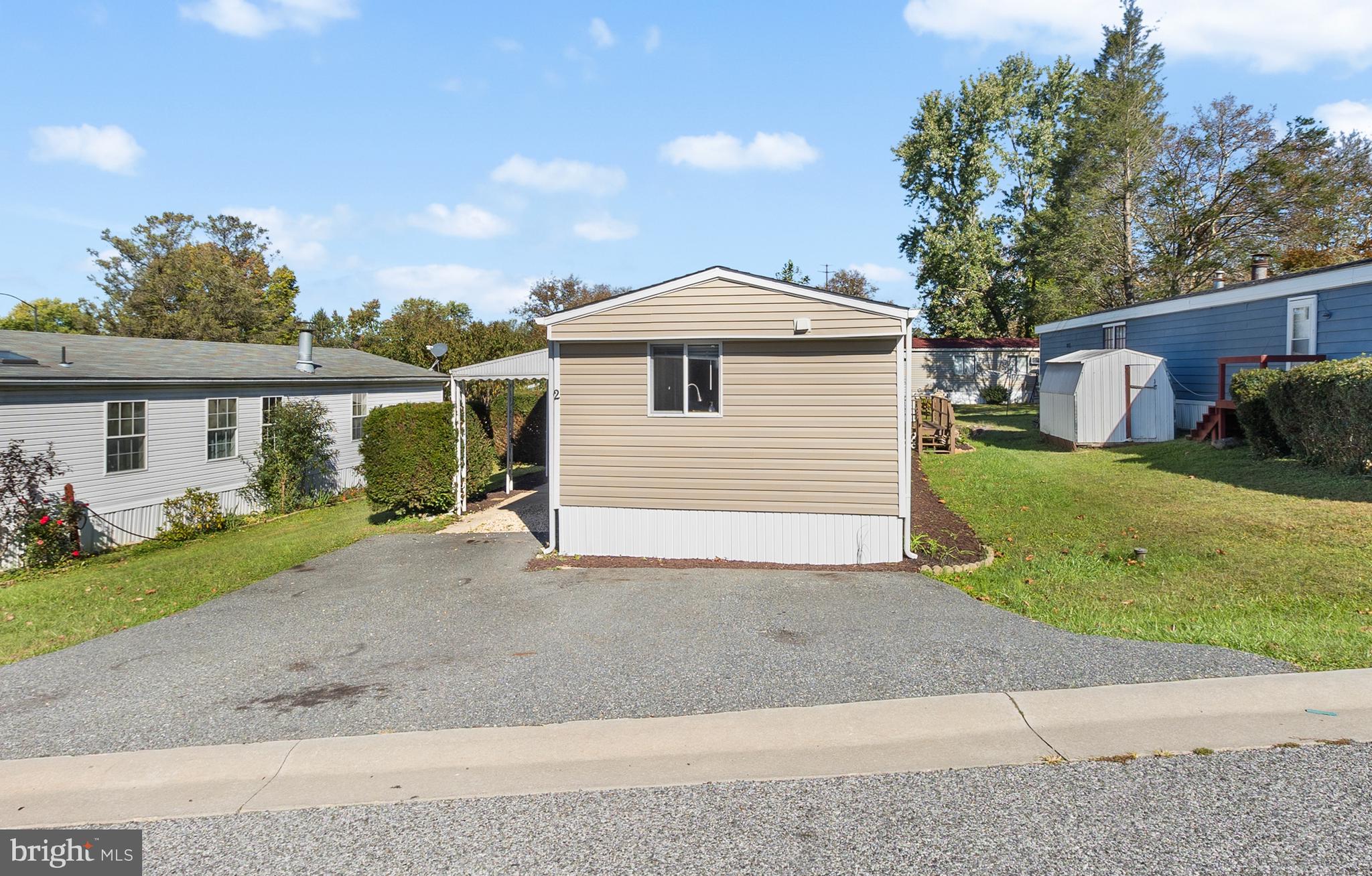2 Westview Way West Grove, PA 19390 - Photo 22 of 26 a front view of a house with a yard and garage