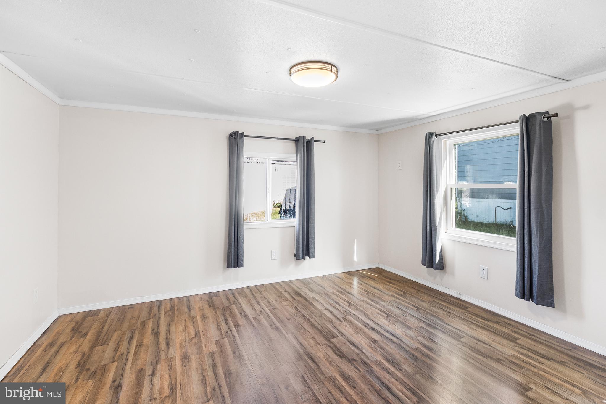 2 Westview Way West Grove, PA 19390 - Photo 4 of 26 a view of a big room with wooden floor and windows