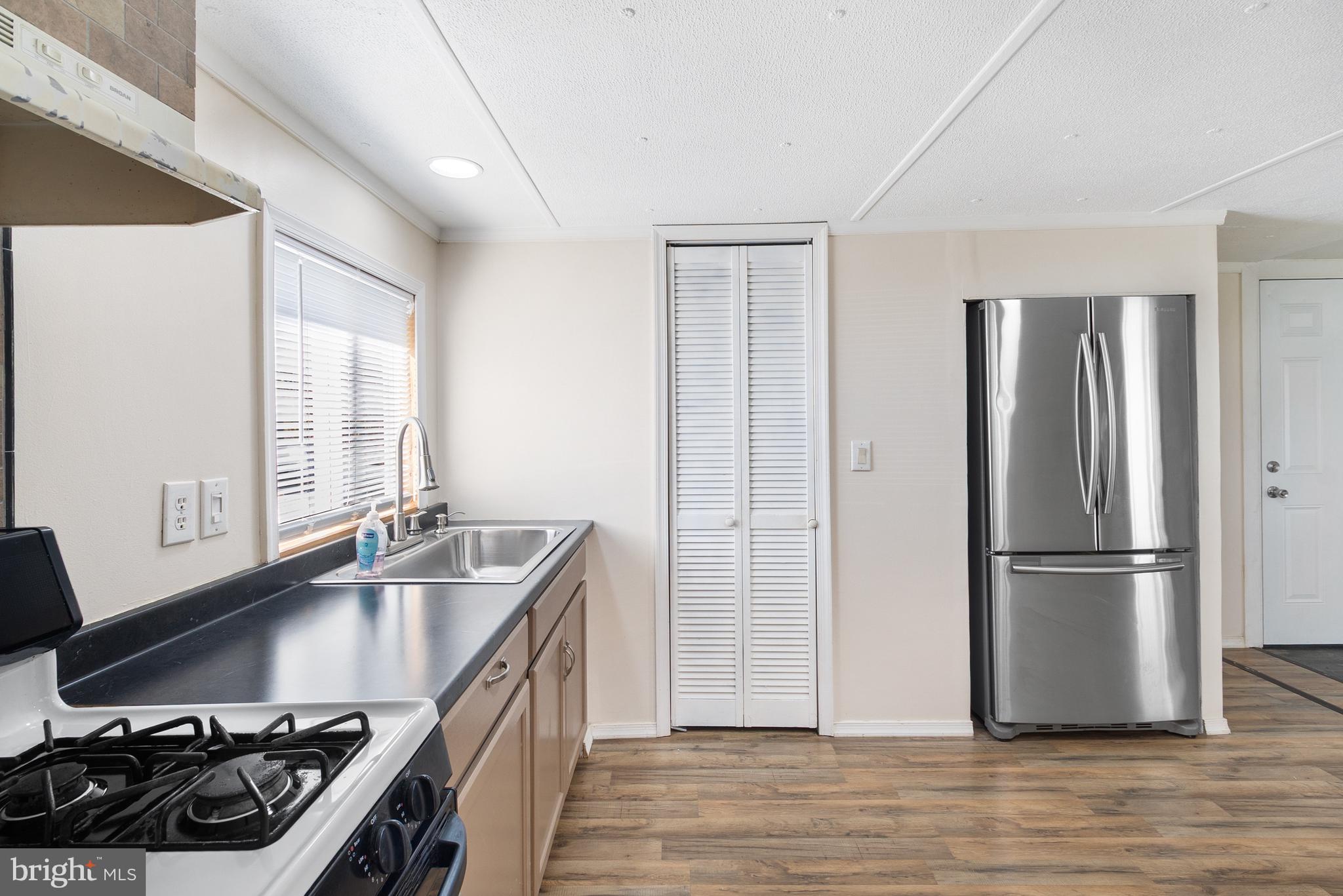 2 Westview Way West Grove, PA 19390 - Photo 6 of 26 a kitchen with stainless steel appliances granite countertop a sink stove and refrigerator