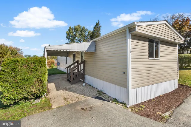 a view of a house with a yard and garage