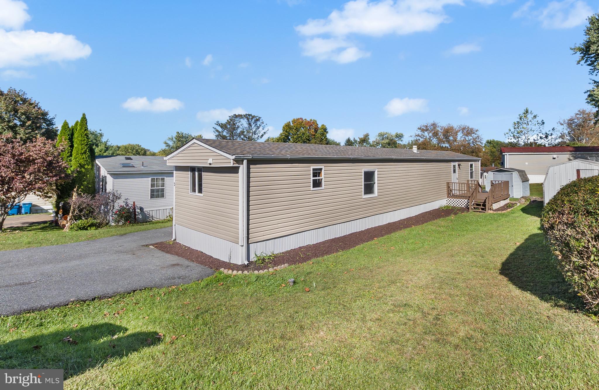 2 Westview Way West Grove, PA 19390 - Photo 8 of 26 a front view of a house with a garden and yard