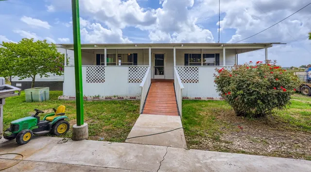 a front view of house with yard