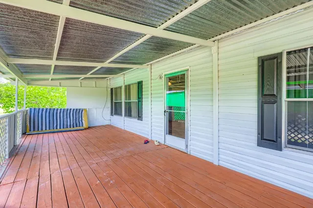 a balcony with wooden floor