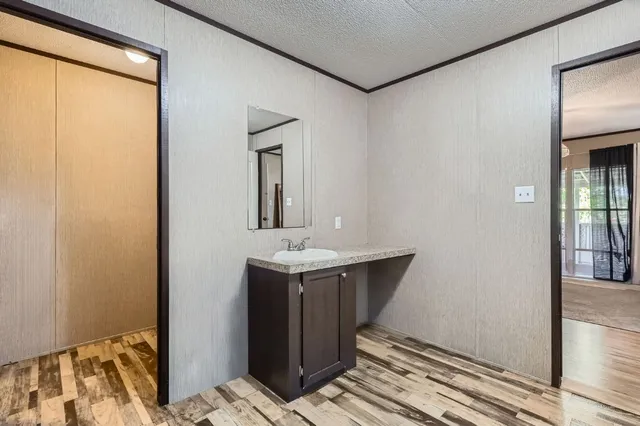 a en suite bathroom with a sink and a mirror